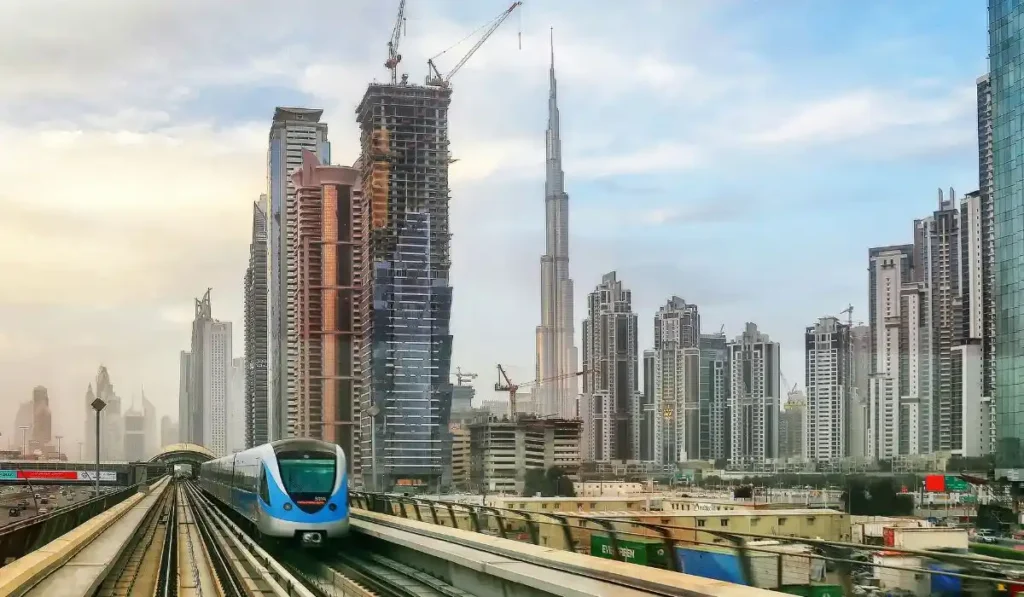 metro train with burj khalifa in background